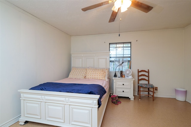 bedroom with a textured ceiling and ceiling fan