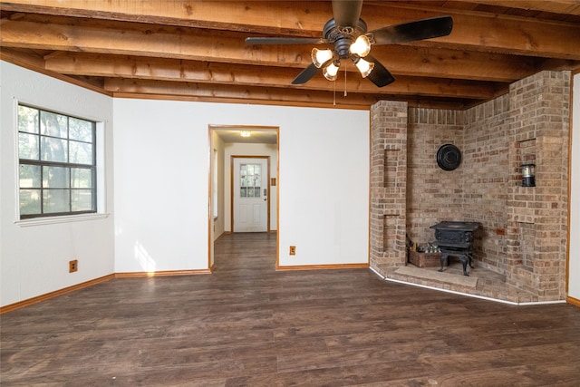 unfurnished living room featuring dark wood-type flooring, wood ceiling, beamed ceiling, and a wood stove