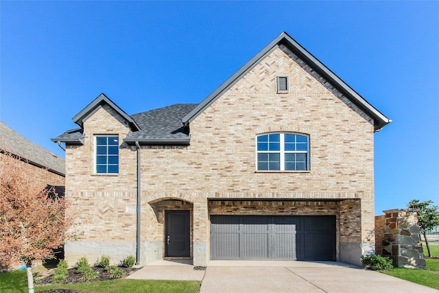 1526 Teresa Ann Ln, Allen, TX 75013 - french country style house featuring a garage, a shingled roof, driveway, and brick siding