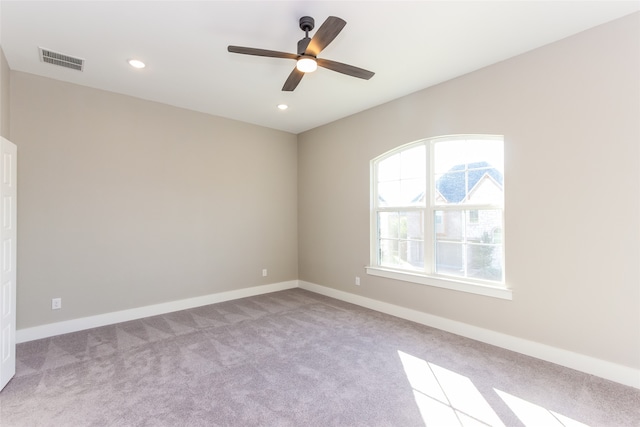 carpeted empty room with ceiling fan