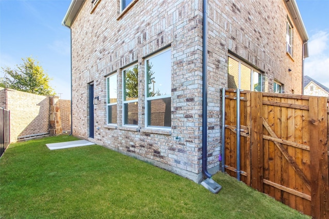 1526 Teresa Ann Ln, Allen, TX 75013 - view of property exterior featuring a lawn, a gate, and fence