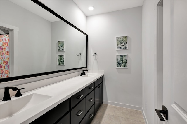 bathroom featuring vanity, a shower with curtain, and tile patterned floors