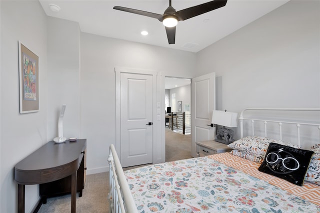 carpeted bedroom with ceiling fan