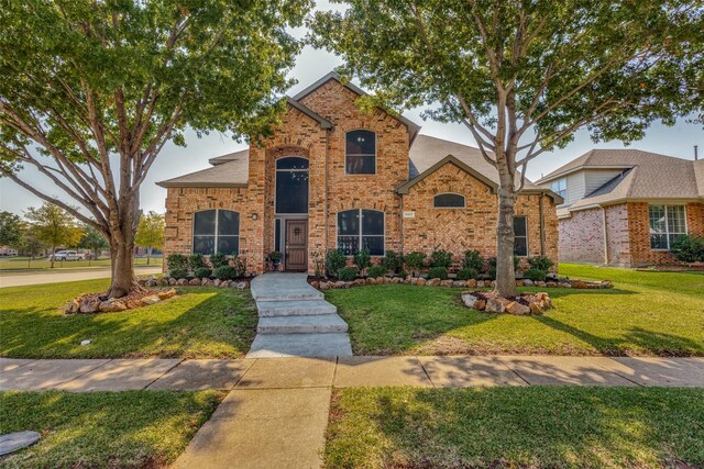 front facade with a front lawn