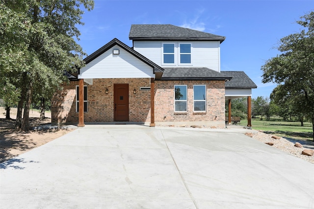 view of front of home featuring a carport