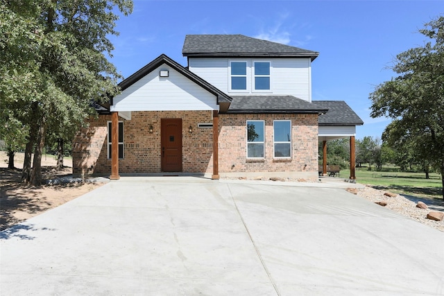 365 Jakes Ln, Poolville, TX 76487 - view of front of home featuring covered porch, brick siding, and a shingled roof