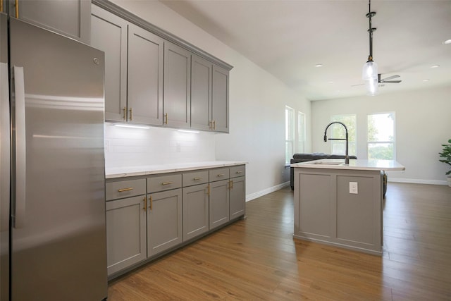 365 Jakes Ln, Poolville, TX 76487 - kitchen with freestanding refrigerator, gray cabinetry, baseboards, wood finished floors, and recessed lighting
