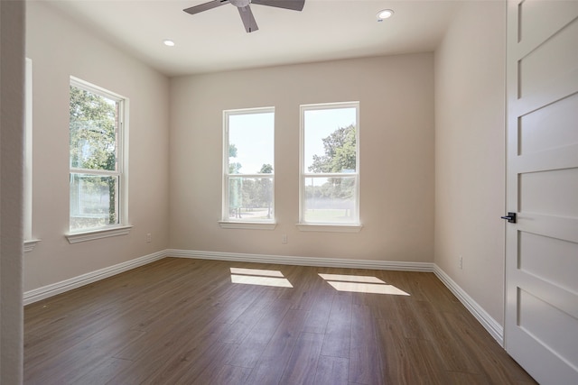 unfurnished room featuring ceiling fan and dark hardwood / wood-style flooring