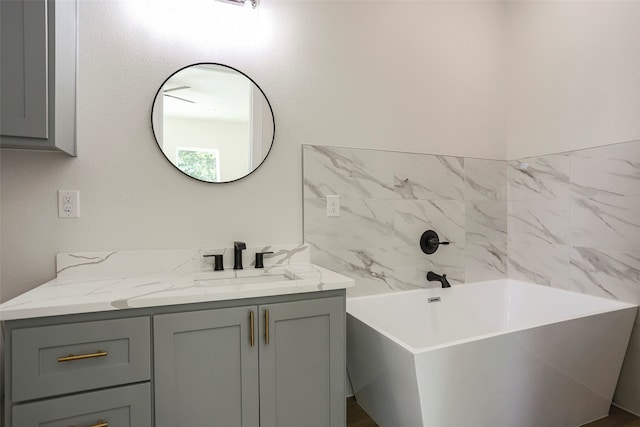 bathroom with a bathtub and vanity