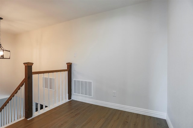 365 Jakes Ln, Poolville, TX 76487 - spare room featuring wood finished floors, baseboards, and a chandelier