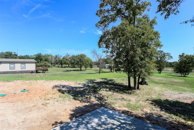 view of yard with a rural view