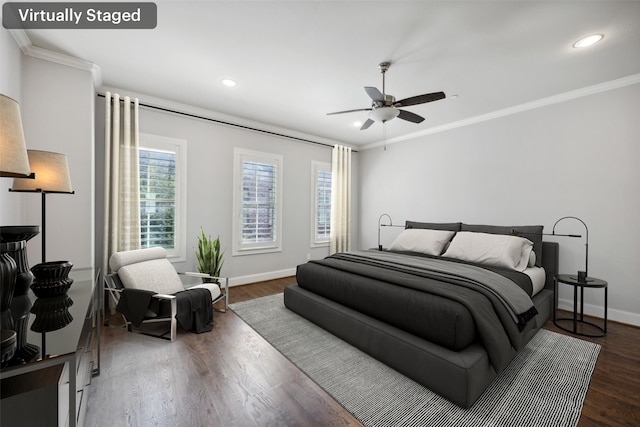 bedroom with dark hardwood / wood-style flooring, crown molding, and ceiling fan