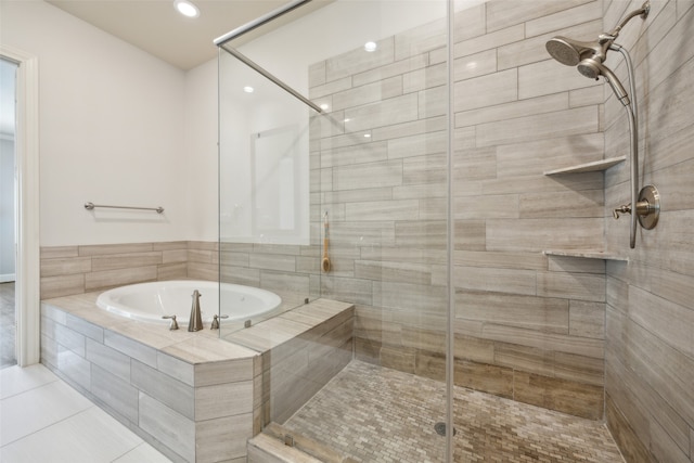 bathroom featuring independent shower and bath and tile patterned floors