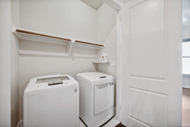 laundry room with separate washer and dryer