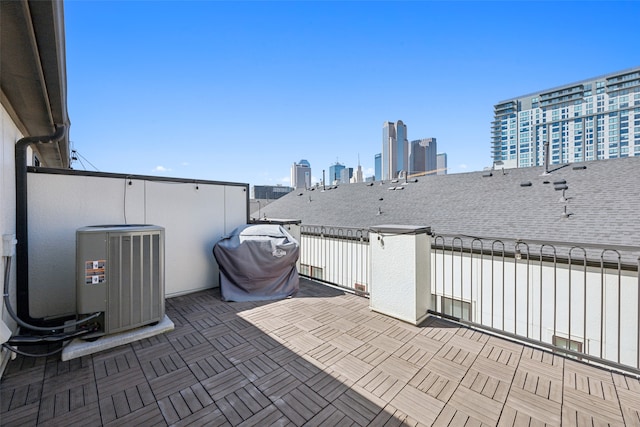 view of patio / terrace featuring central AC unit and a grill