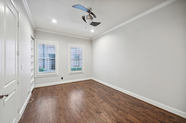 empty room featuring crown molding, dark hardwood / wood-style floors, and ceiling fan