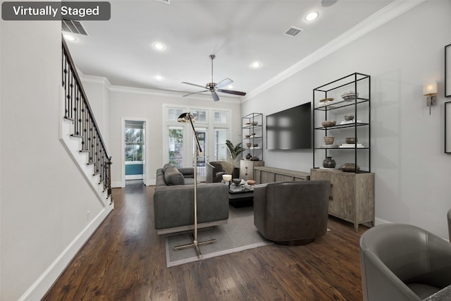 living room with ornamental molding, dark hardwood / wood-style floors, and ceiling fan