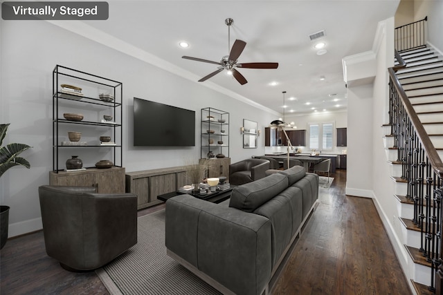 living room featuring crown molding, dark hardwood / wood-style floors, and ceiling fan