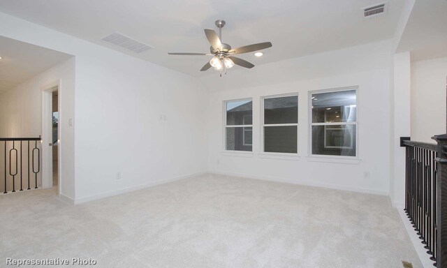 2414 Plumeria Ln, Celina, TX 75009 - empty room featuring light colored carpet, a ceiling fan, and visible vents