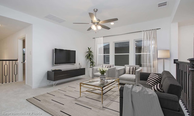 carpeted living room featuring ceiling fan