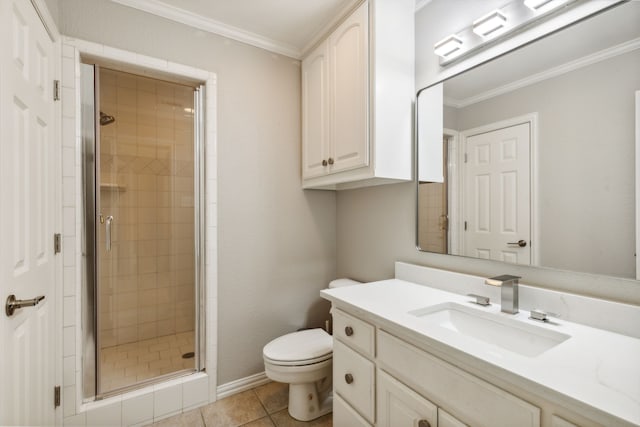 bathroom featuring walk in shower, toilet, ornamental molding, vanity, and tile patterned floors