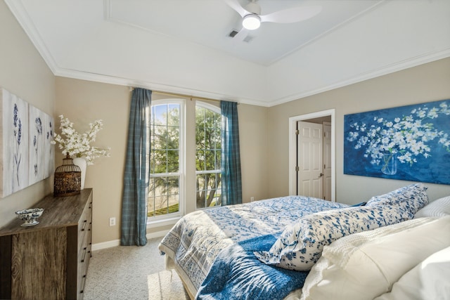 carpeted bedroom featuring ceiling fan and crown molding