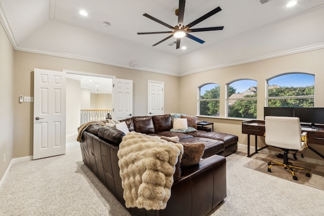 carpeted living room with crown molding, a tray ceiling, and ceiling fan