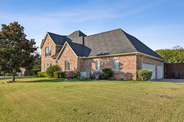 view of front property featuring a front yard and a garage