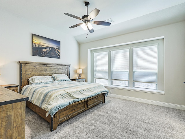 bedroom with carpet floors, vaulted ceiling, and ceiling fan