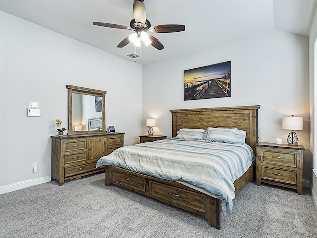 bedroom with ceiling fan, light carpet, and vaulted ceiling