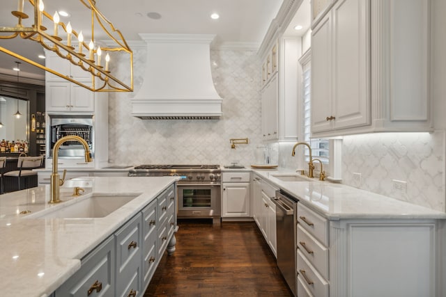 kitchen featuring ornamental molding, sink, and white cabinetry