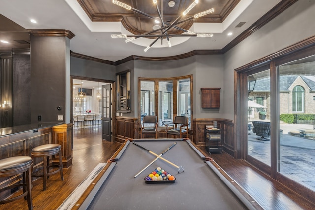 playroom featuring billiards, ornamental molding, dark hardwood / wood-style flooring, and indoor bar