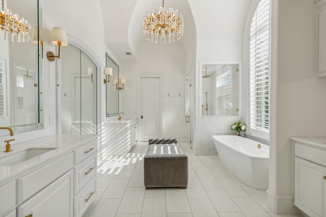 bathroom featuring vanity, separate shower and tub, high vaulted ceiling, and tile patterned flooring