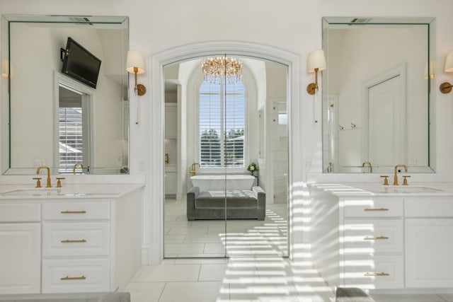 6408 Drawbridge Ln, Plano, TX 75024 - bathroom featuring a sink, tile patterned flooring, two vanities, and plenty of natural light