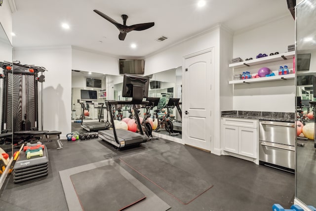 workout room featuring crown molding and ceiling fan