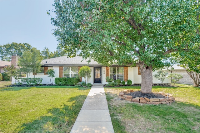 view of front of home featuring a front lawn