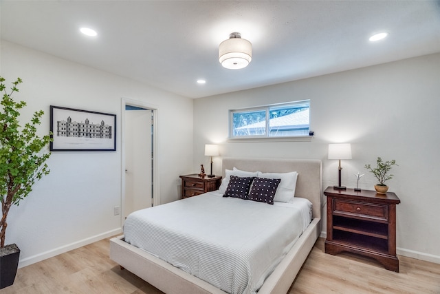 bedroom with light hardwood / wood-style flooring