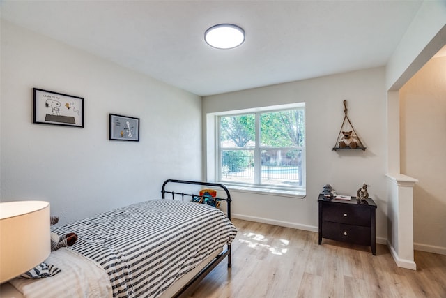 bedroom with light hardwood / wood-style floors