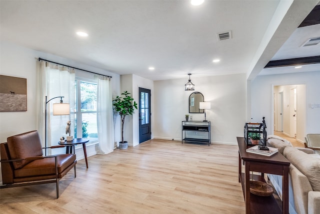 living room with light hardwood / wood-style floors