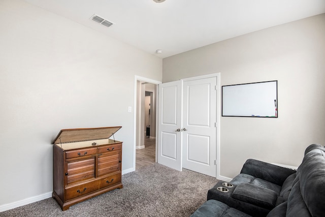 sitting room with carpet flooring