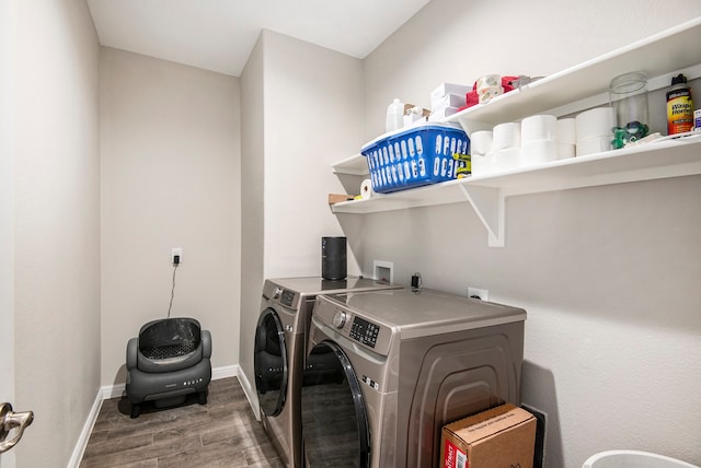 clothes washing area featuring hardwood / wood-style flooring and separate washer and dryer