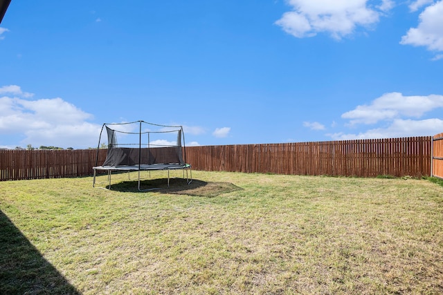 view of yard with a trampoline