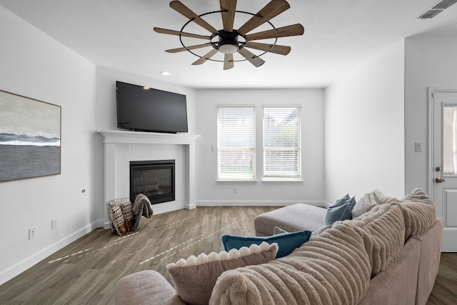 living room with ceiling fan and hardwood / wood-style flooring