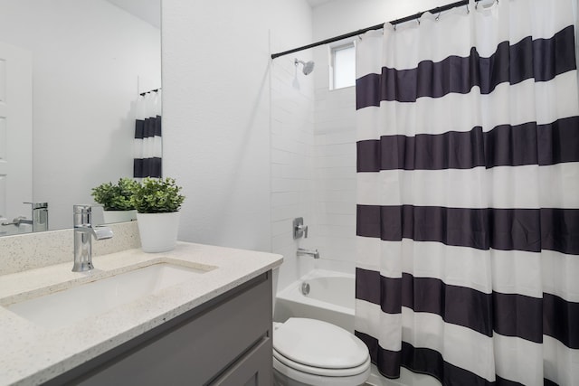 full bathroom featuring vanity, shower / bath combo, and toilet