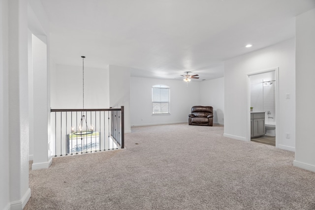 empty room with ceiling fan and carpet floors