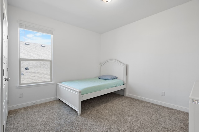 bedroom featuring light colored carpet