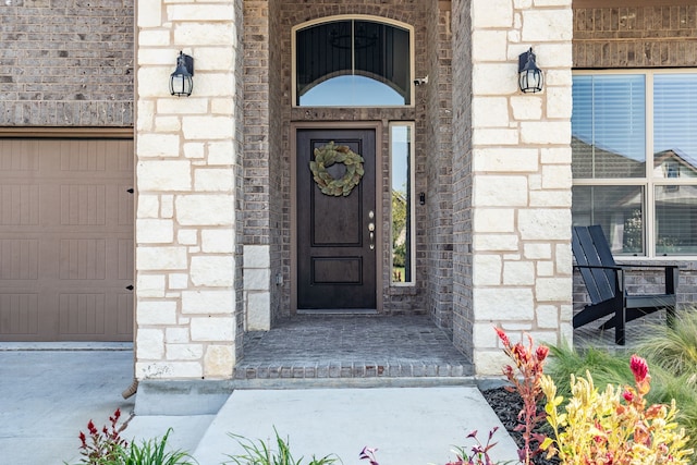 doorway to property featuring a garage