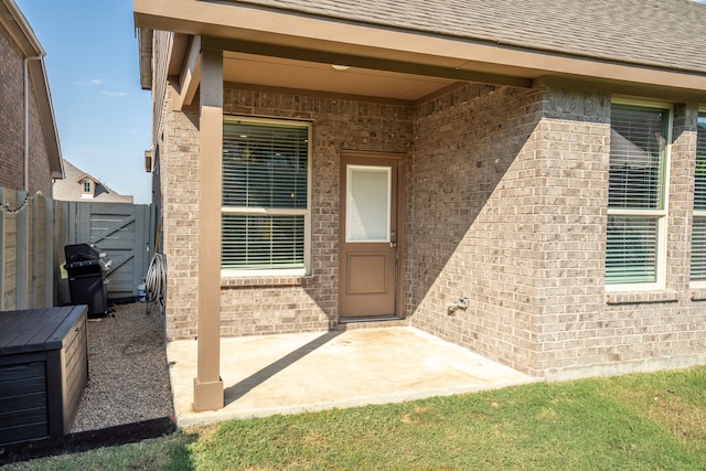 entrance to property featuring a patio