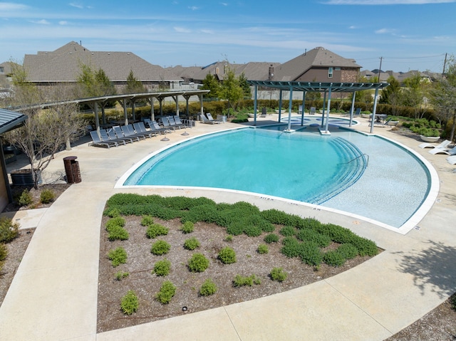 view of pool with a patio and a pergola