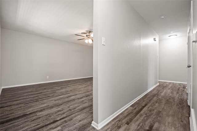 corridor with dark wood-type flooring